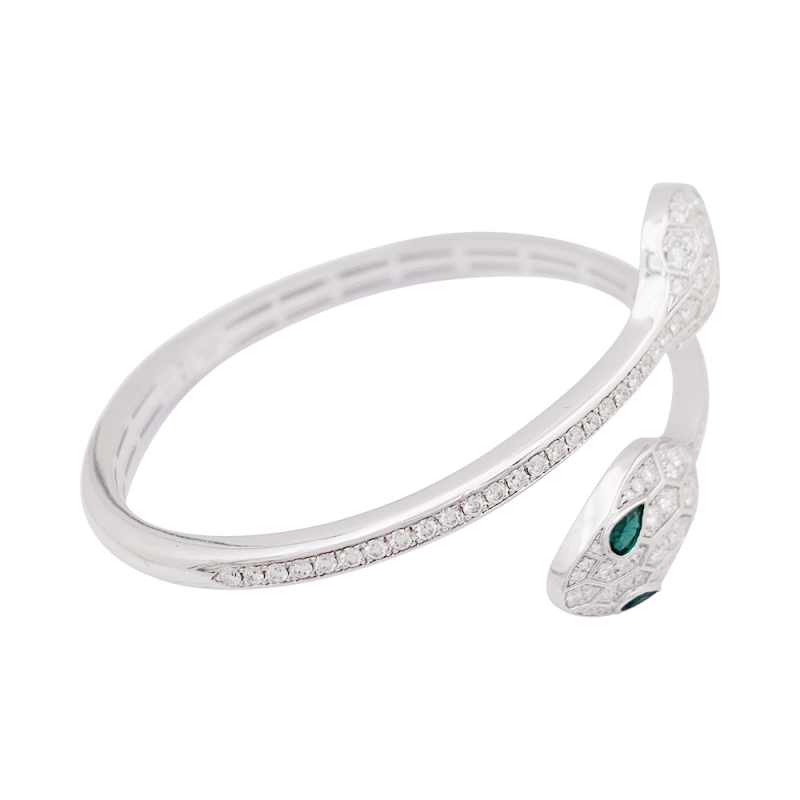 Bracelet Bulgari "Serpenti Seduttori" or blanc, diamants, émeraudes.