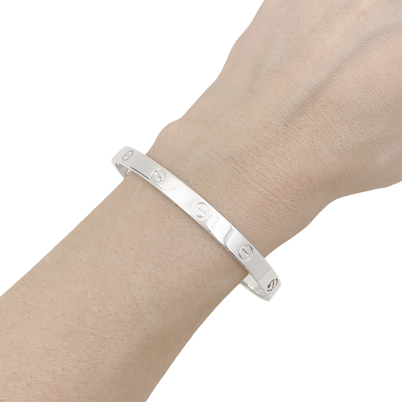 Bracelet Cartier "Love" or blanc.