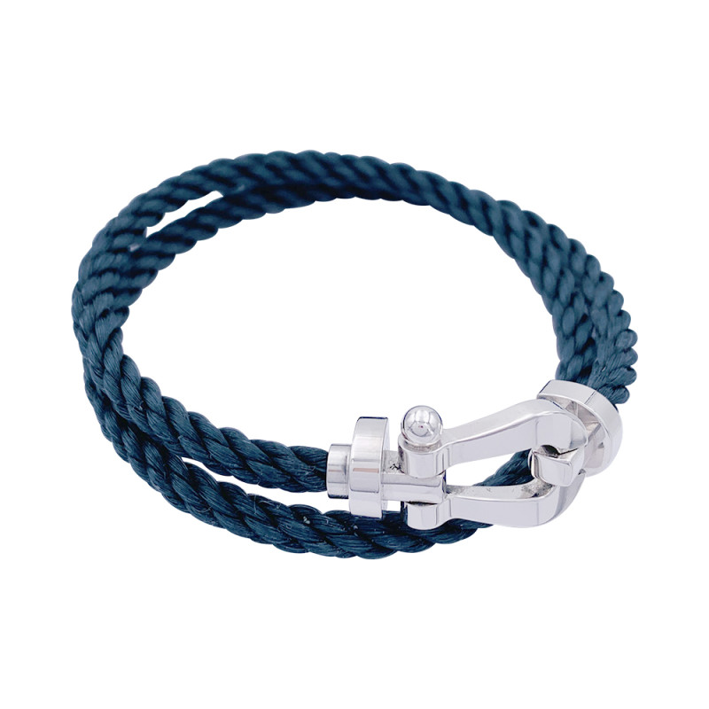 Bracelet Fred, "Force 10", en or blanc et acier.