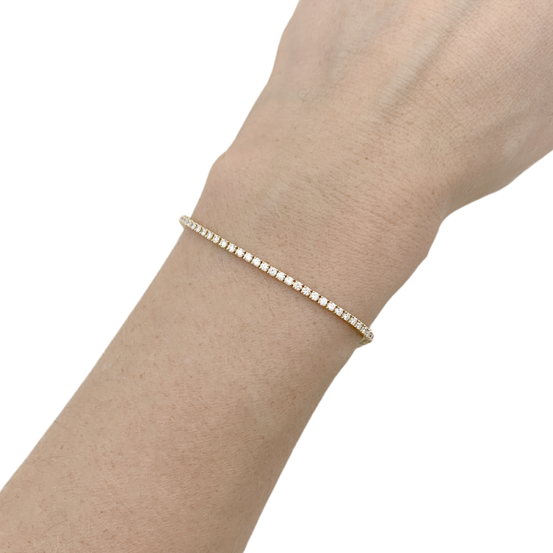 Bracelet ligne tennis or rose, diamants.