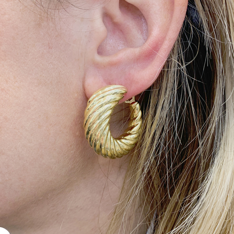 Yellow gold twisted hoops.