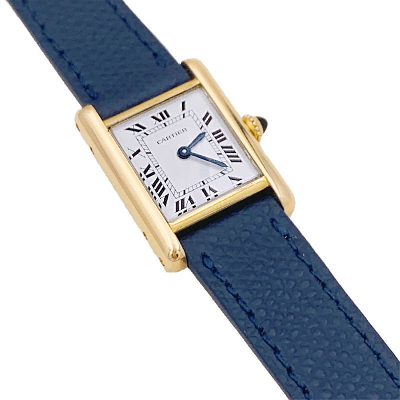 Cartier gold watch, "Tank Louis Cartier" collection.