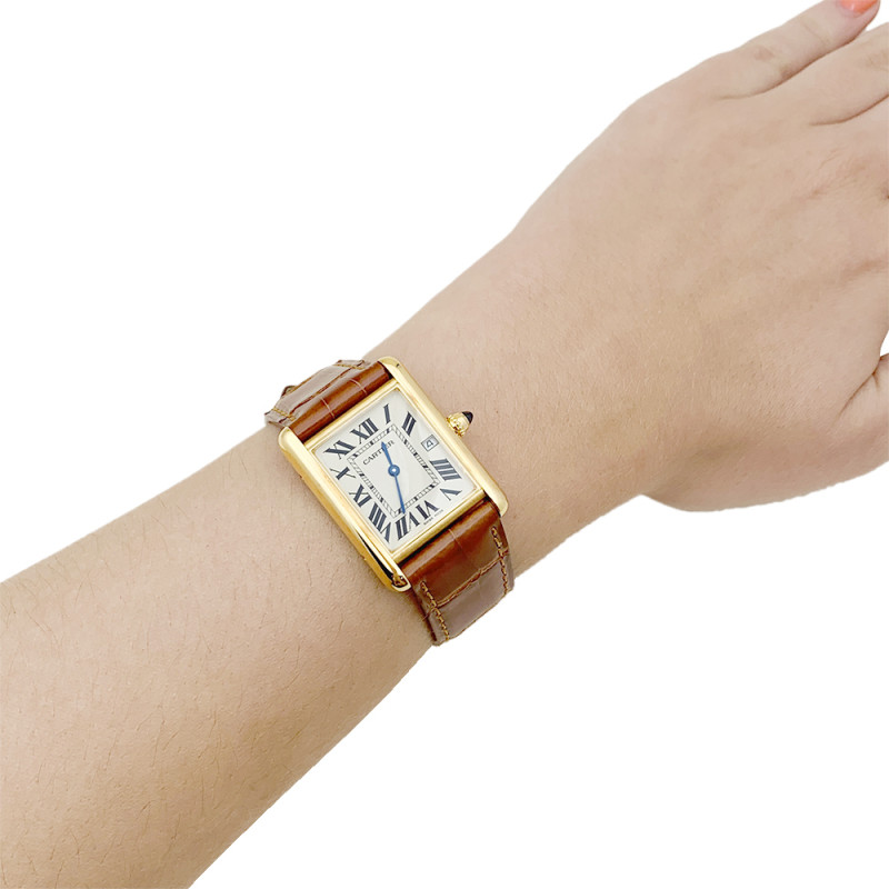 Montre Cartier "Tank Louis Cartier" or jaune, cuir.