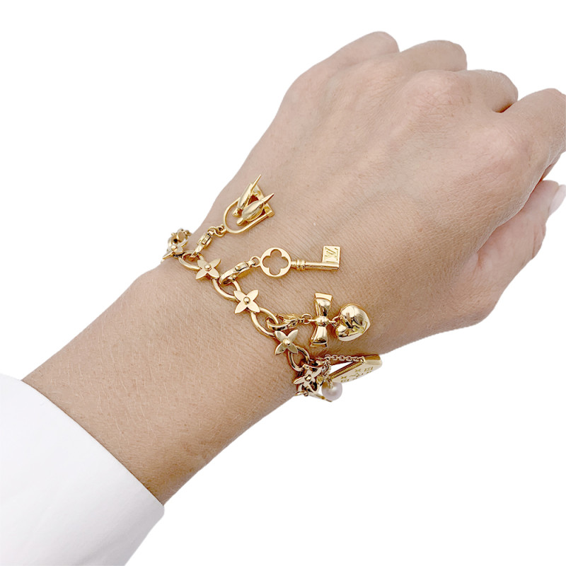 Louis Vuitton bracelet, Idylle collection, charms, yellow gold, white  gold, pearls.
